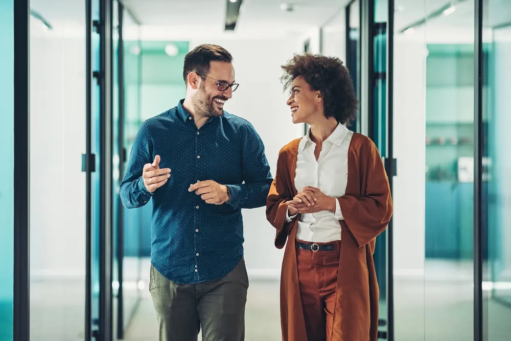Maaike Kok Smiling business persons having a conversation